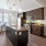 a kitchen with an island and a wood floor